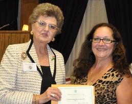 Carolyn Abojarah with Swaledale Garden Club award, presented by NGC President Renee Blaschke