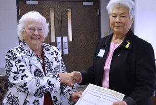 Sandy Wales presents Kinglsey Garden Club Award to Darla Rock